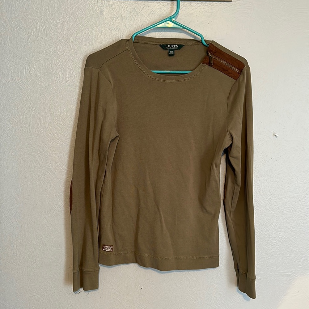 Really cute long sleeve shirt!! It is marked as a Large but fits small medium